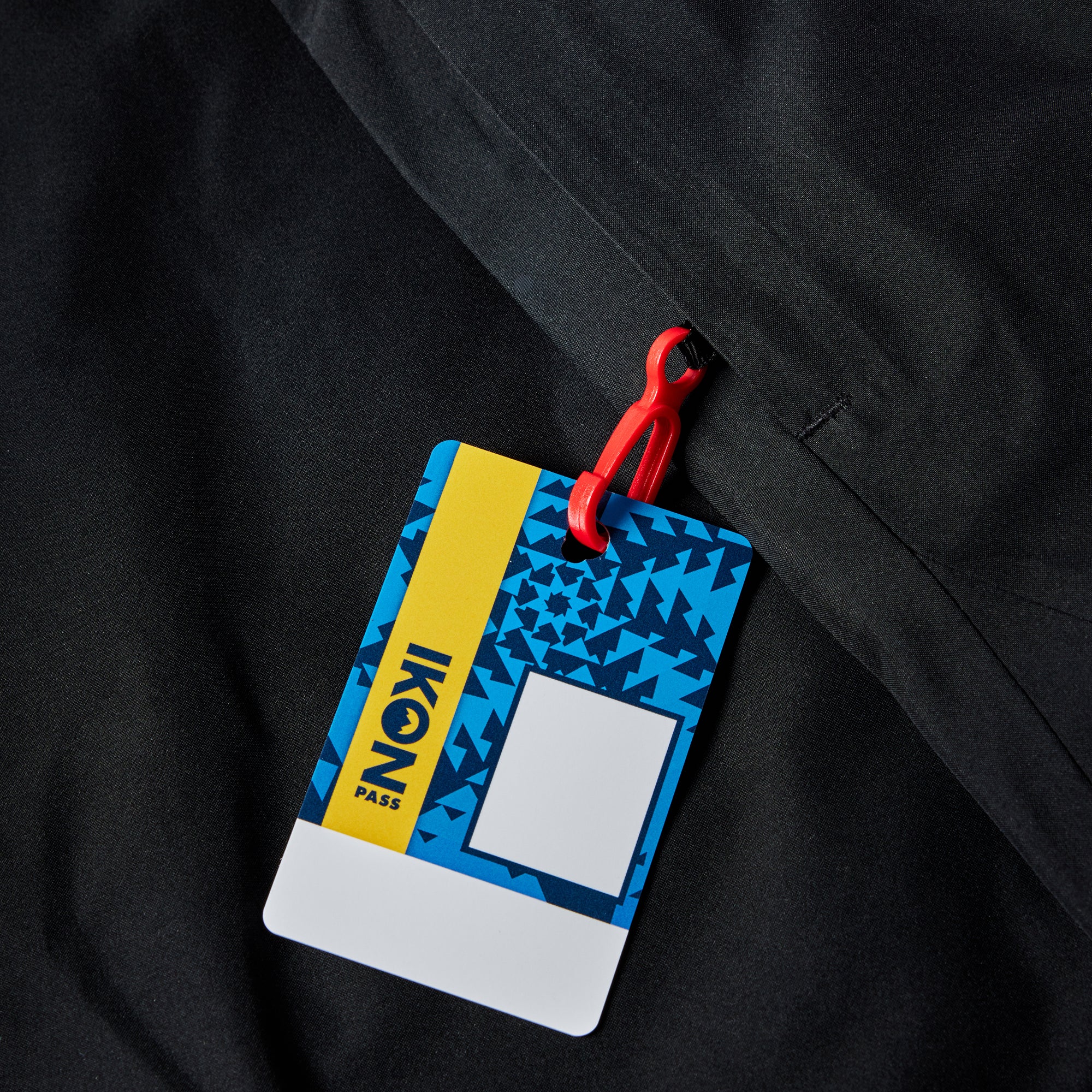 The 686 Iron Maiden insulated battle jacket has a black background with blue accents and an iron maiden graphic on the front.