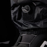 The 686 brand Gore-Tex GT pants are showcased in this image from the front view, featuring a black color with white stitching and a zippered leg.