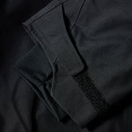 The 686 GORE-TEX GT Shell Jacket 2025 has a black color and is being displayed from the front view.