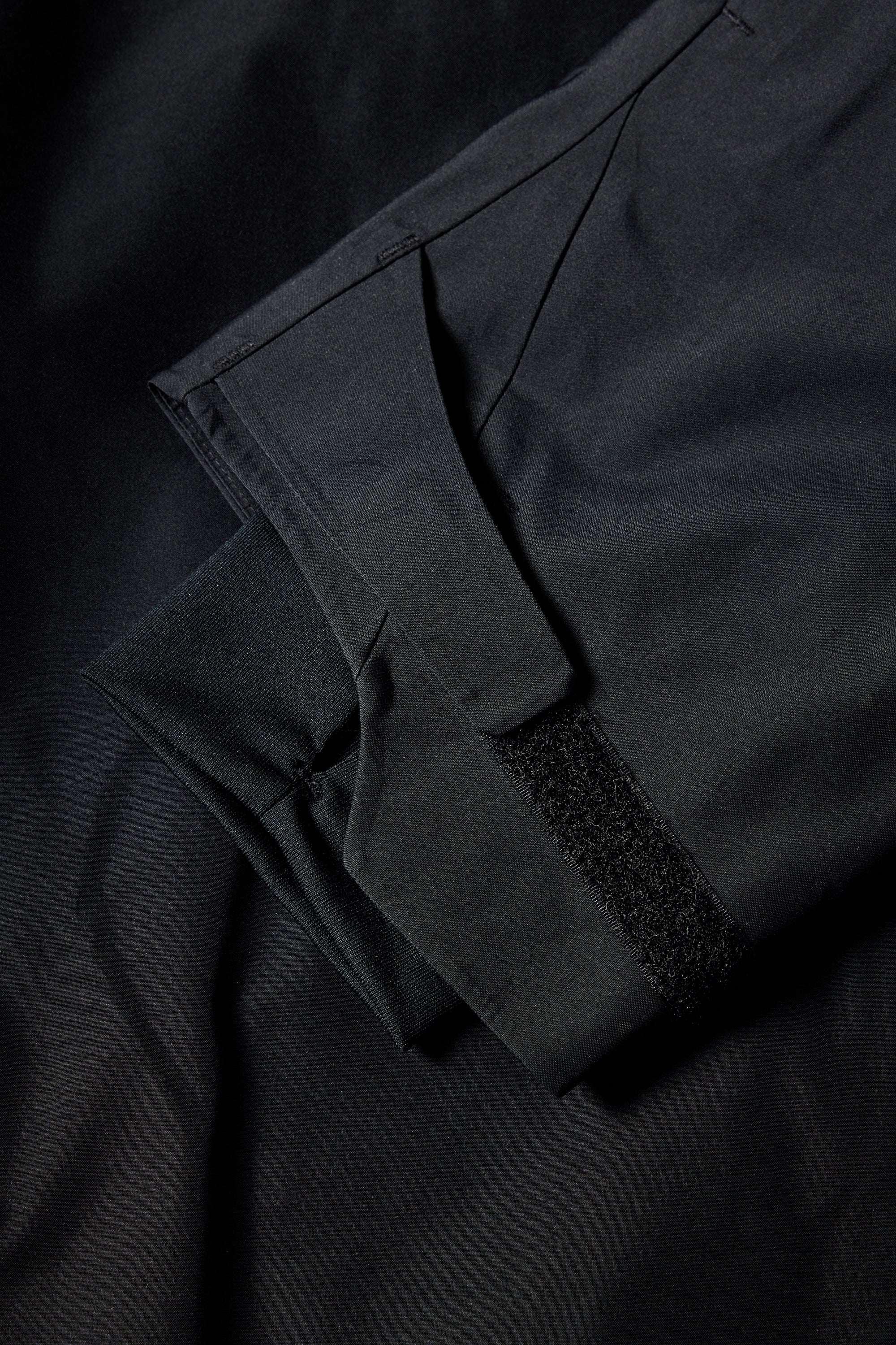 The 686 Women's GORE-TEX Skyline Shell Jacket 2025 is dark gray with a black fleece-lined hood.