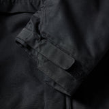The 686 Renewal Insulated Anorak Jacket 2025 is black with an insulated hood and adjustable cuffs.