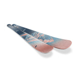 Nordica Women's Santa Ana 97 Skis 2026 - A pair of skis with a blue and pink graphic design featuring a mountain range, set against a white background.