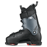 Black ski boot with red sole accents, side view