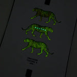 Burton Process Board Flying V Snowboard 2025 - A black snowboard with a white and green striped pattern on its top side.