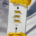 Burton Process Board Flying V Snowboard 2025 - White snowboard with yellow and black striped tiger graphics on top.