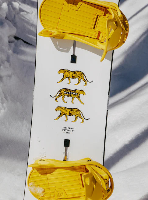 Burton Process Board Flying V Snowboard 2025 - White snowboard with yellow and black striped tiger graphics on top.