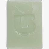 Burton All-Season Fast Snowboard Wax 80g 2025 - A rectangular bar of light green wax with a smooth, glossy surface and no visible patterns or textures.