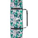 Burton Space Sack Snowboard Bag - A white snowboard bag with a repeating pattern of green and pink flowers, featuring black straps and zippers.