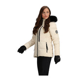 Obermeyer Women's Circe Down Jacket - A cream-colored down jacket with a black zipper and two zippered pockets on either side.
