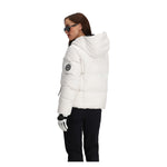 Obermeyer Women's Calypso Down Jacket - A white down jacket with a hood, featuring a black zipper and two zippered pockets on either side.