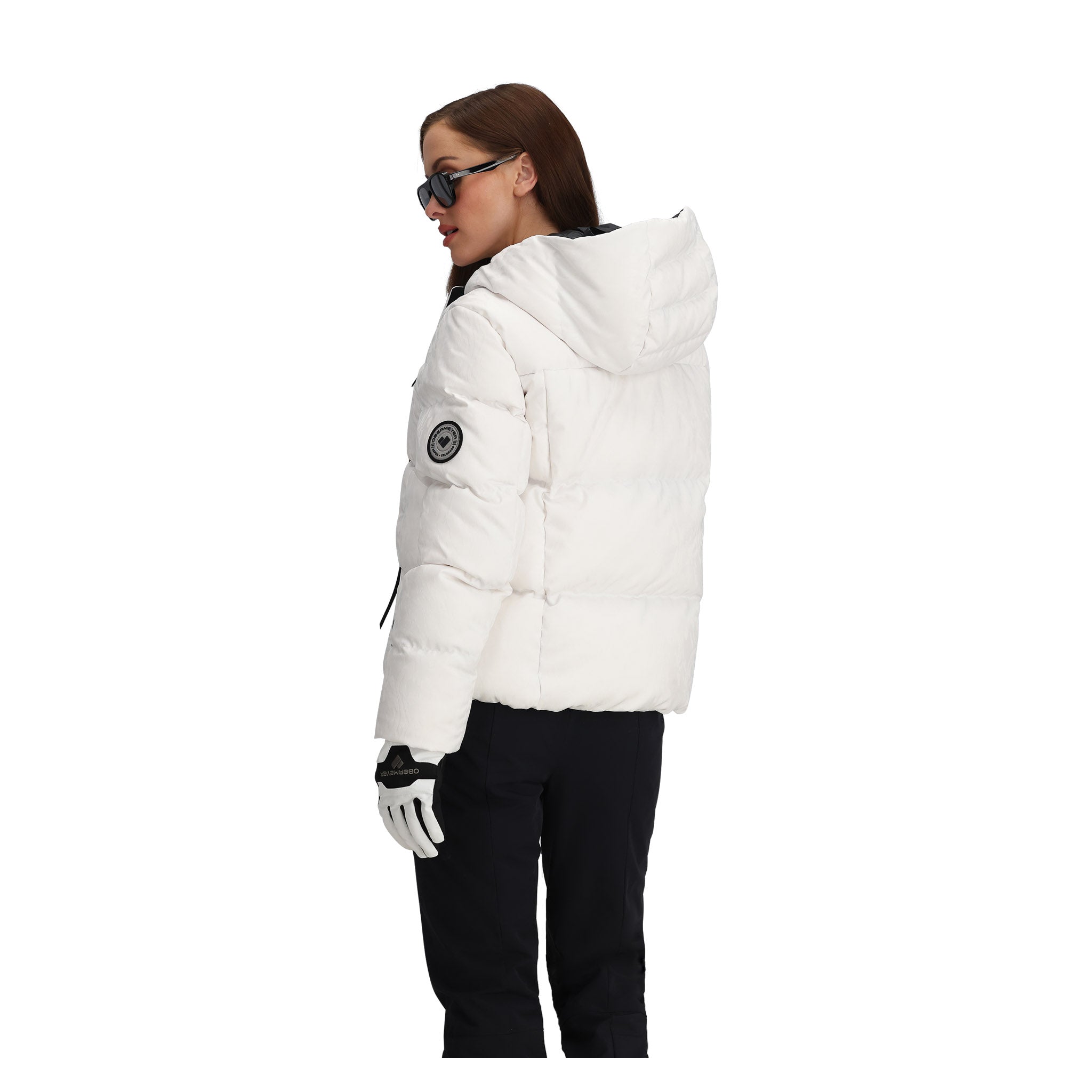 Obermeyer Women's Calypso Down Jacket - A white down jacket with a hood, featuring a black zipper and two zippered pockets on either side.