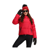 Obermeyer Women's Calypso Down Jacket - A red down jacket with a high collar and zippered pockets, worn by a model posing in front of a white background.