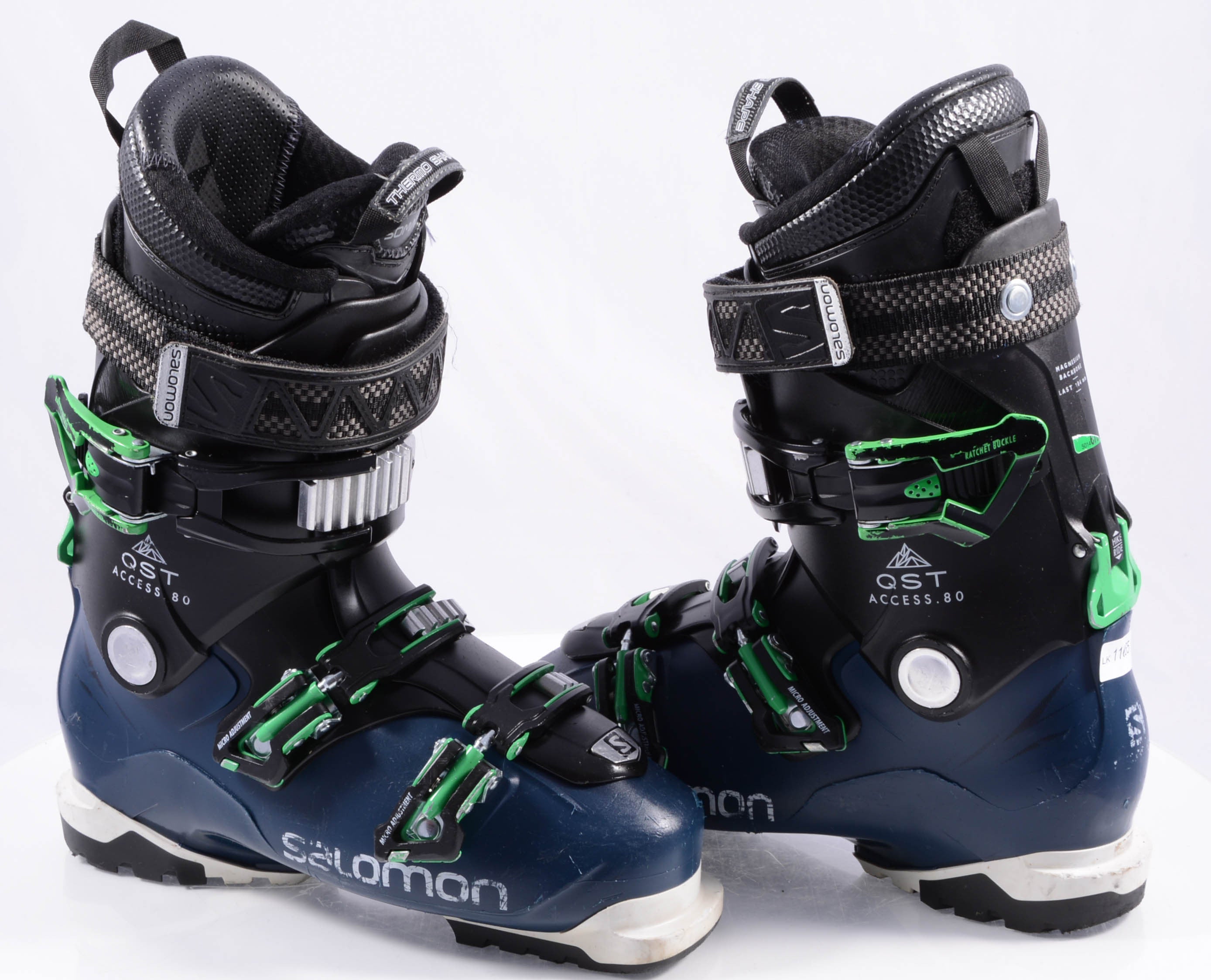 Salomon QST Access 80 Ski Boots 2023 - Black ski boots with green accents and silver buckles.