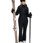 Women’s black insulated ski suit with hood and front zipper, shown with skis and gloves.