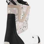 Burton Moto Boa Snowboard Boots 2025 - A pair of snowboard boots with a black and white color scheme, featuring a distinctive boa closure system on the top.