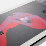 Burton Talent Scout Snowboard 2025 - A snowboard with a black base and white accents, featuring a distinctive logo on its top surface.