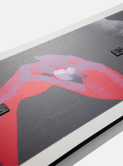 Burton Talent Scout Snowboard 2025 - A snowboard with a black base and white accents, featuring a distinctive logo on its top surface.