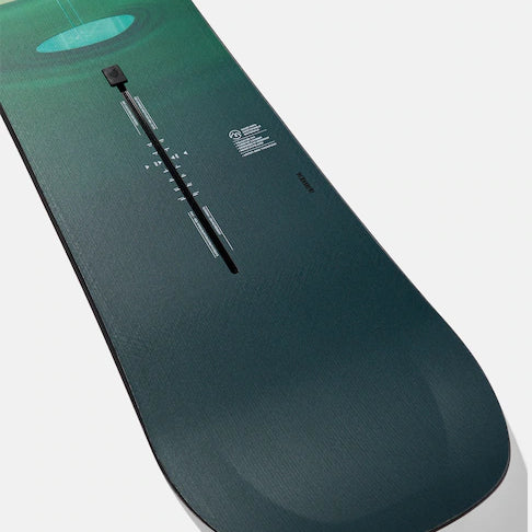 Burton Women's Yeasayer Snowboard 2025 - A green and blue snowboard with a circular design on top.