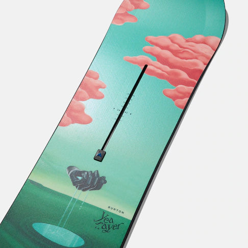 Burton Women's Yeasayer Snowboard 2025 - A green snowboard with a pink cloud design on top of a mountain landscape.