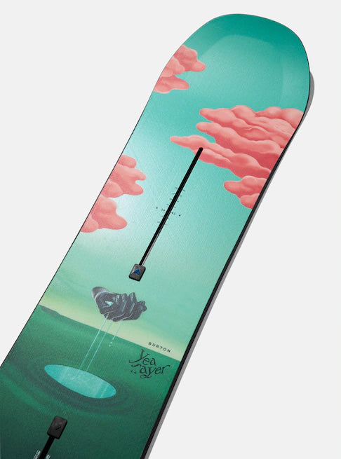 Burton Women's Yeasayer Snowboard 2025 - A green snowboard with a pink cloud design on top of a mountain landscape.