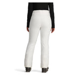 Obermeyer Women's Bliss Insulated Pant 2025 - A pair of white insulated ski pants with a zippered pocket on the side and a small logo patch near the left hip.