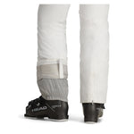 Obermeyer Women's Bliss Insulated Pant 2025 - A pair of white insulated ski pants with a zippered pocket on the side and a belt loop at the waist.