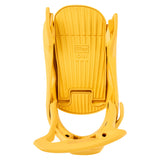 Burton Women's Step On Bindings 2025 - A yellow snowboard binding with a textured surface and ridges on top, featuring the words "Step ON" in raised letters.