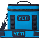 Yeti Hopper Flip 8 Personal Cooler - A blue cooler with a zipper and handle on top, featuring the word "YETI" in white letters on one side.
