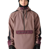 The 686 brand's waterproof anorak jacket has a light brown body with dark purple accents on the shoulders and upper arms.