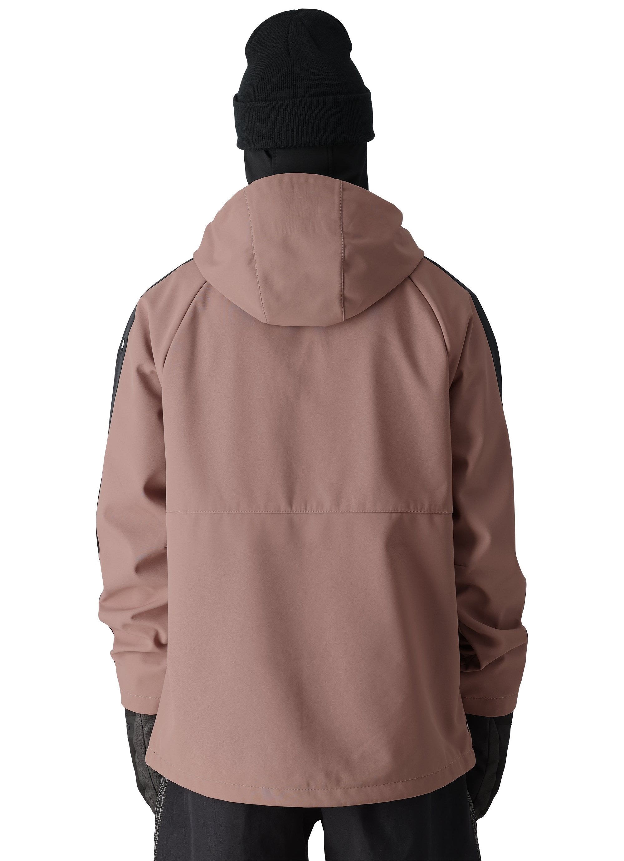 The 686 Waterproof Anorak Jacket 2025 is primarily light brown with black accents on the sleeves.