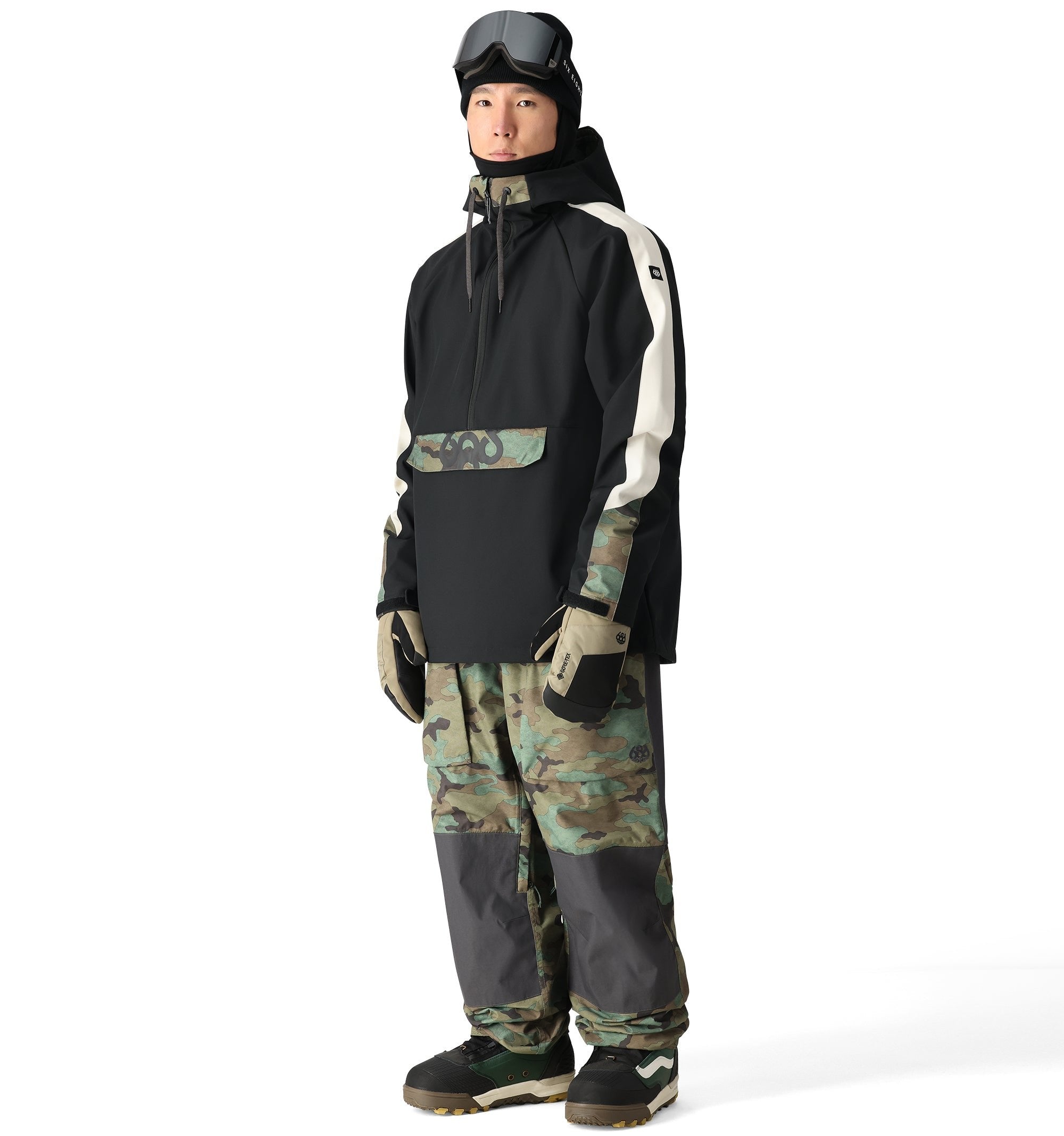 The 686 Waterproof Anorak Jacket 2025 is predominantly black with white stripes down both arms.