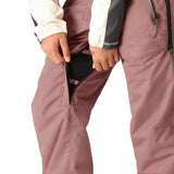 The 686 Women's Black Magic Insulated Bib 2025 is primarily pink with black accents and features an insulated hood.