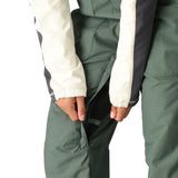 The 686 Women's Black Magic Insulated Bib 2025 is shown in black with an insulated hood.