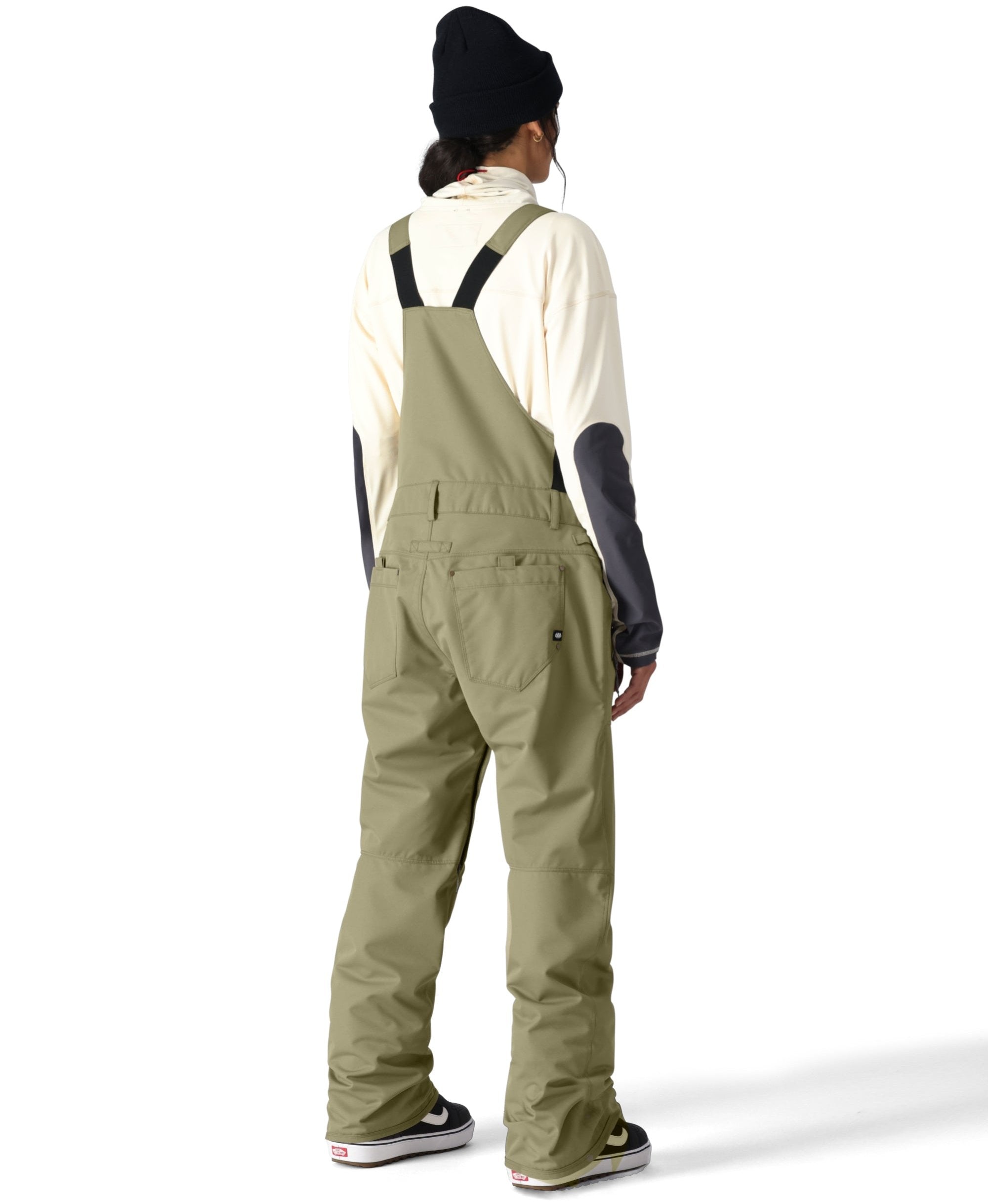 The 686 brand black snow bibs with an insulated design are shown from the front view.