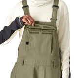 The 686 Women's Black Magic Insulated Bib 2025 appears in a black color with an insulated hood.