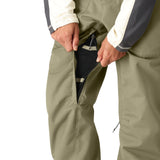 The 686 Women's Black Magic Insulated Bib features a sleek black color with a zippered fly on the front view.