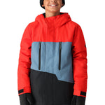 The 686 Youth GEO Insulated Jacket has a red and blue color scheme with a black front panel and two zippered pockets.