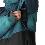 The 686 Foundation Insulated Jacket 2025 is shown from the front with a black and teal ombre design.