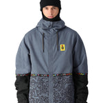 The 686 Foundation Insulated Jacket 2025 is grey with a black pattern on the lower section and has a hood.