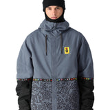 The 686 Foundation Insulated Jacket 2025 is grey with a black pattern on the lower section and has a hood.