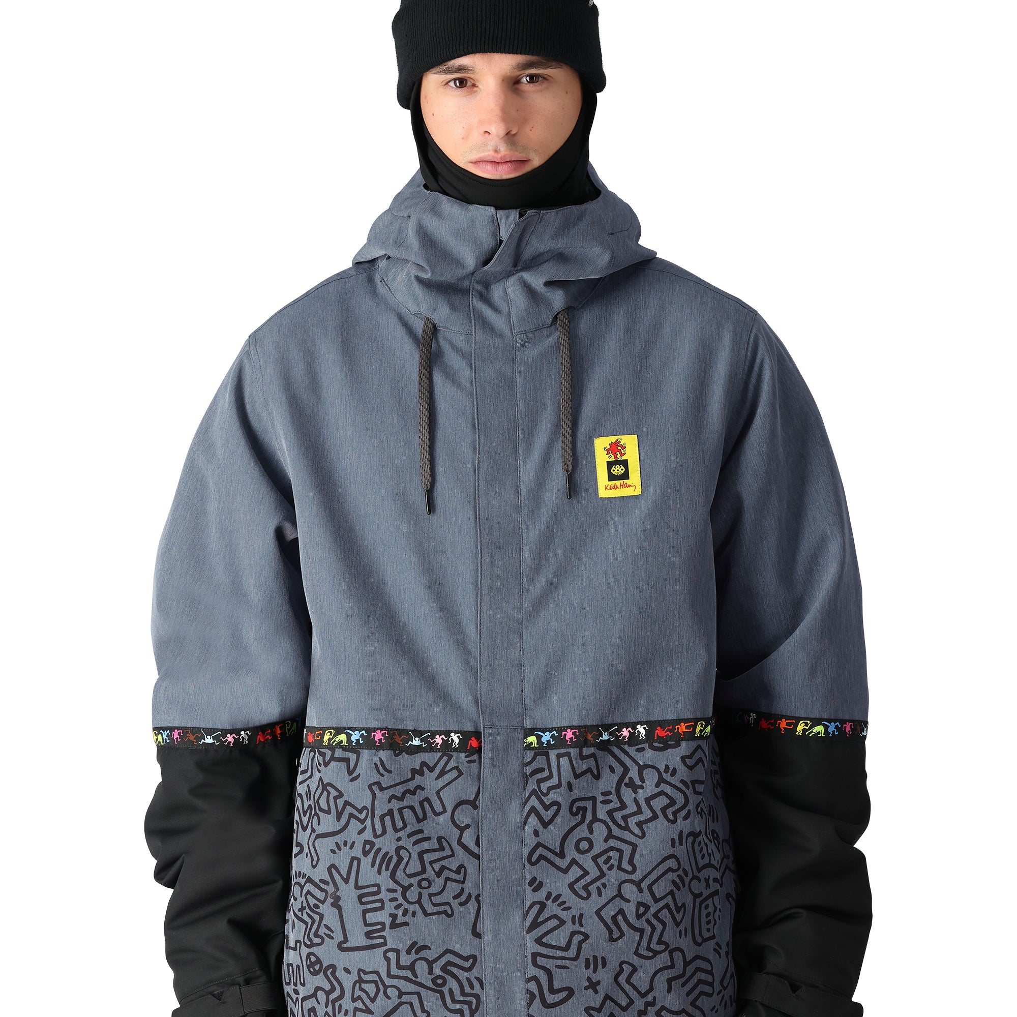 The 686 Foundation Insulated Jacket 2025 is grey with a black pattern on the lower section and has a hood.