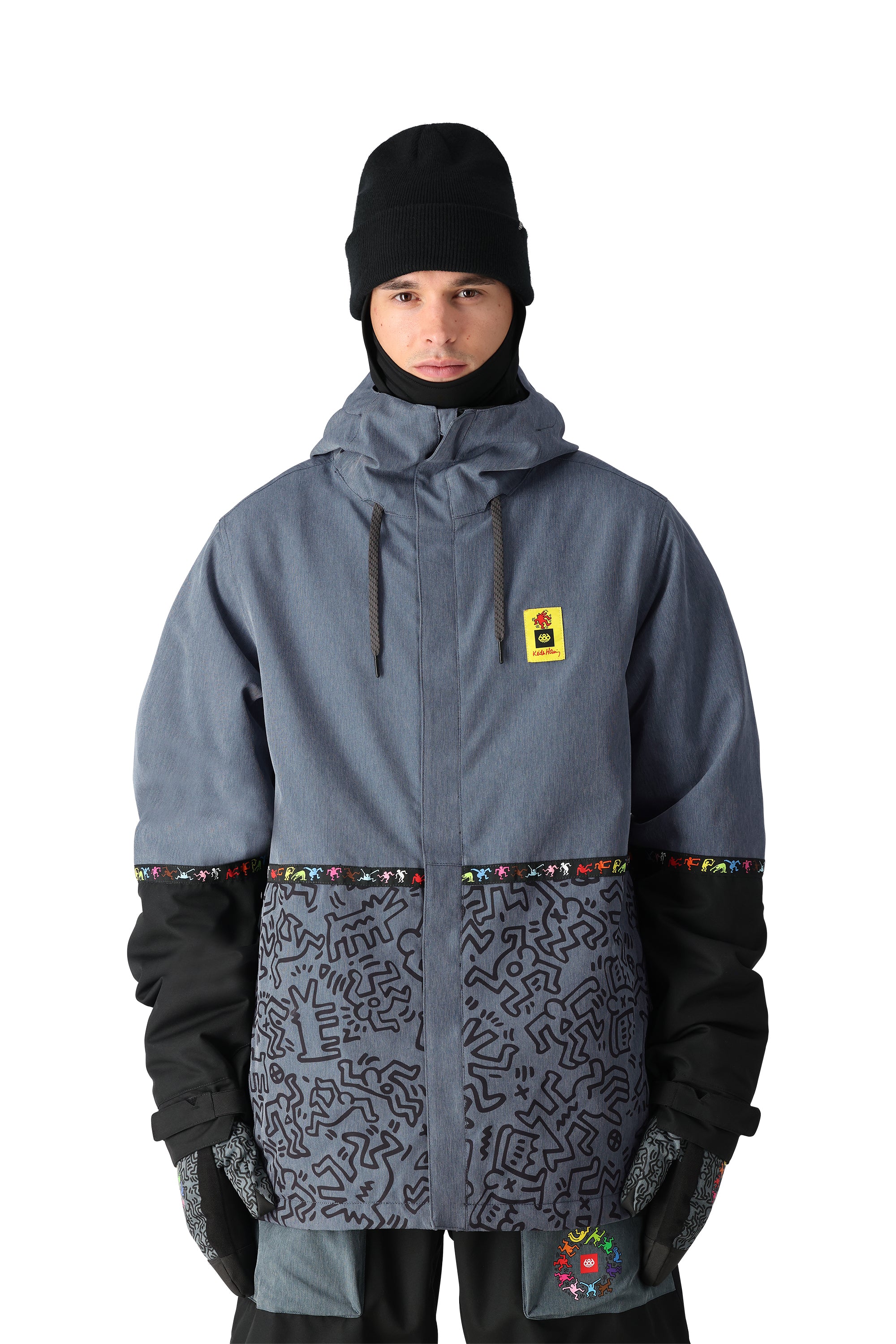 The 686 Foundation Insulated Jacket 2025 is grey with a black pattern on the lower section and has a hood.