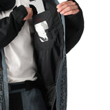 The 686 Foundation Insulated Jacket 2025 is primarily black with a red zipper and red accents on the front.