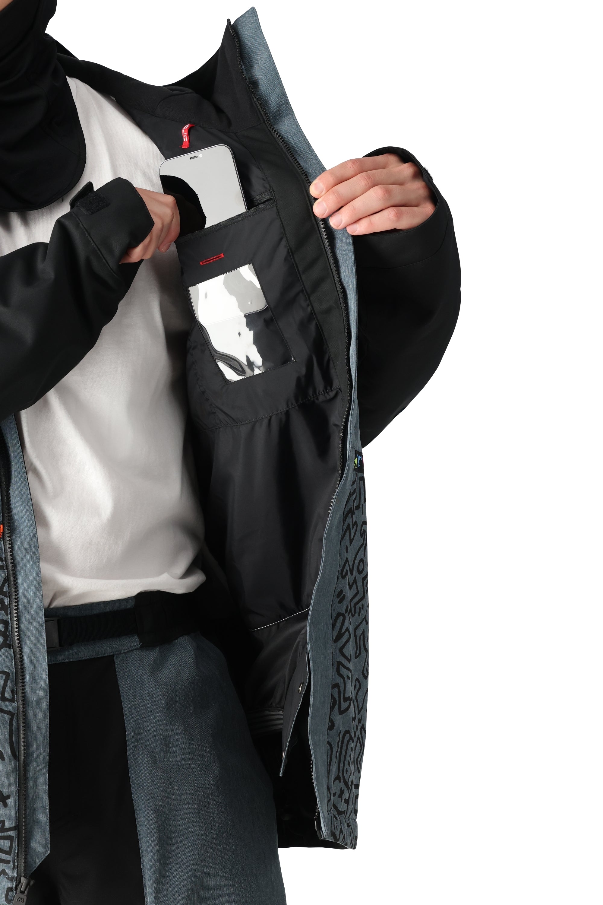 The 686 Foundation Insulated Jacket 2025 is primarily black with a red zipper and red accents on the front.