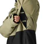 The 686 Foundation Insulated Jacket 2025 has an olive green and black color block design with a zippered front and thumb holes.