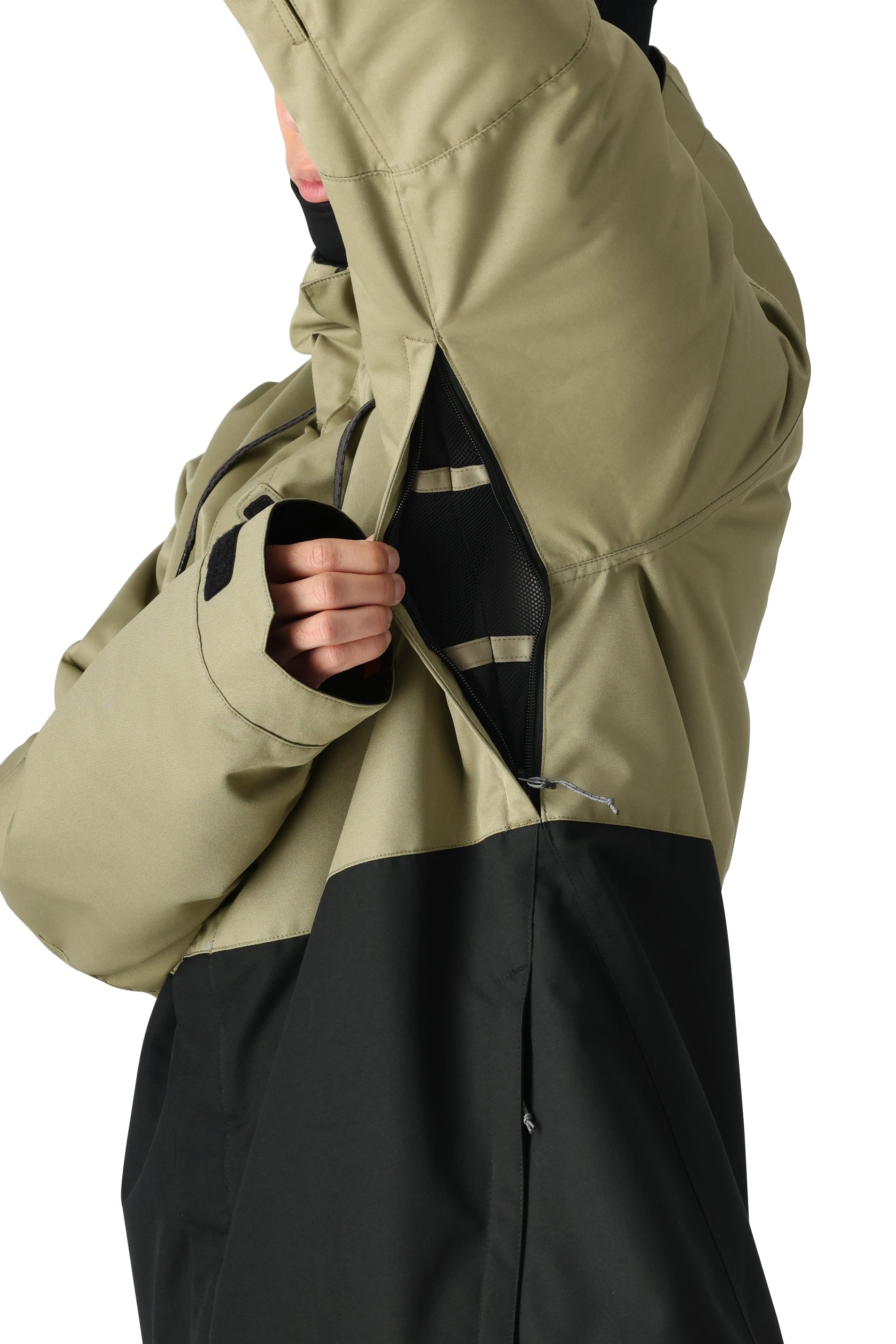 The 686 Foundation Insulated Jacket 2025 has an olive green and black color block design with a zippered front and thumb holes.