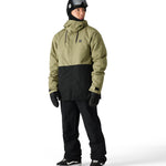 The 686 Foundation Insulated Jacket 2025 is shown in an olive green and black color combination with a high collar.