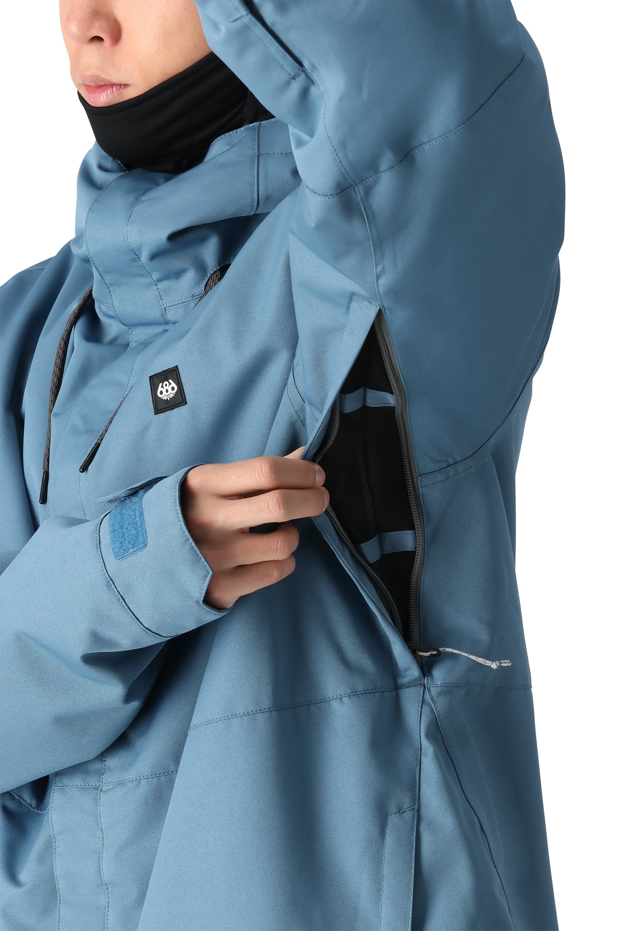 The 686 Foundation Insulated Jacket 2025 in light blue has an insulated hood and appears to be fully zipped up.