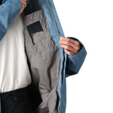 The 686 Foundation Insulated Jacket 2025 is dark blue with an insulated hood and black accents.