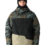 The 686 Geo Insulated Jacket in camouflage pattern has a black front panel and tan accents.